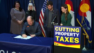 cutting property taxes colorado_gov polis signing.png