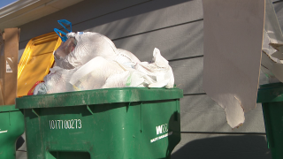 Overflowing trash cart